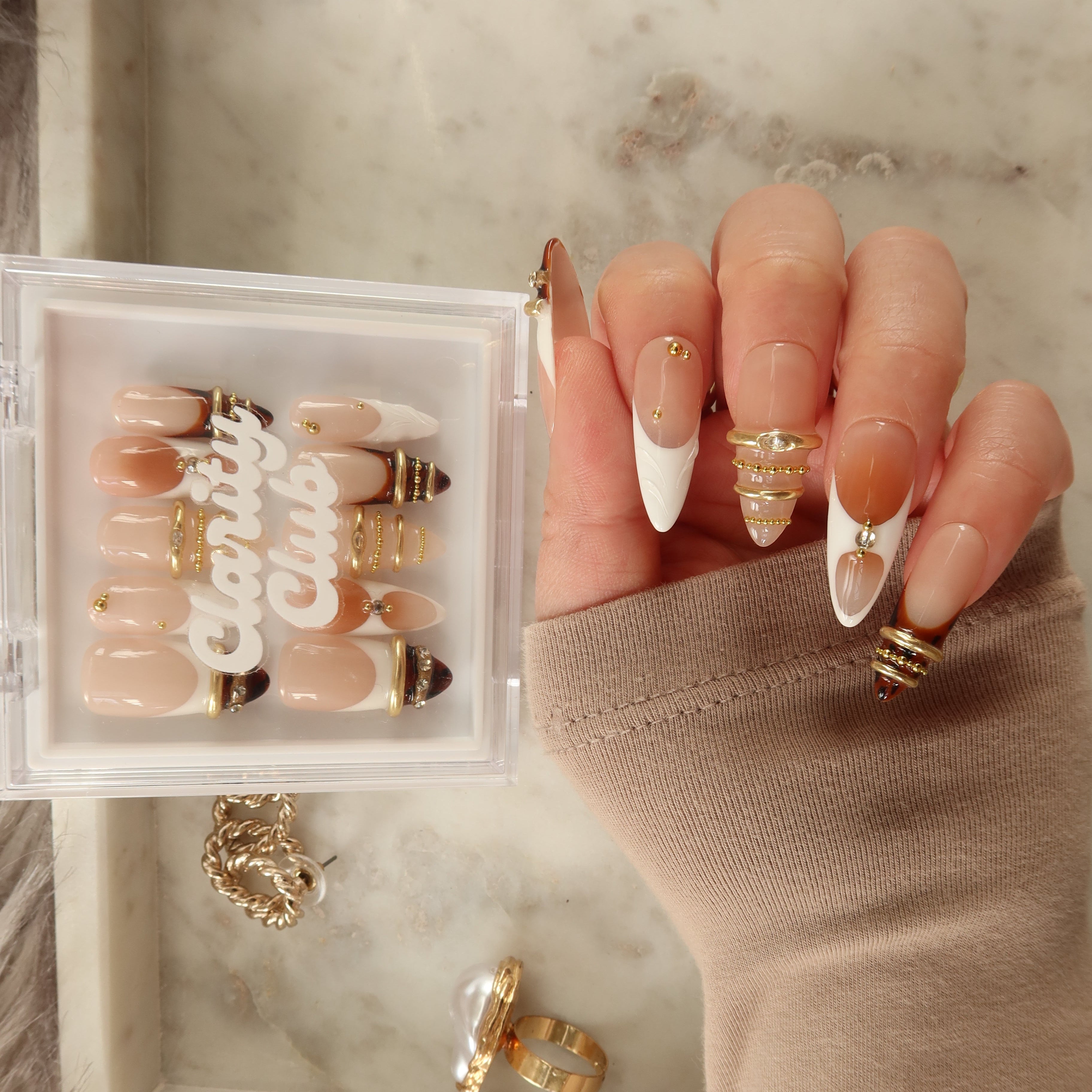 Golden Bangle 3D bangle press on nails NZ — gold rings, rhinestones and tortoise shell on nude ombre almond nails
