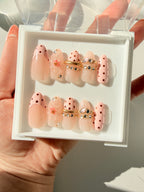 Pink Bangle mid-long almond press on nails worn on hand, Clarity Club NZ salon handmade