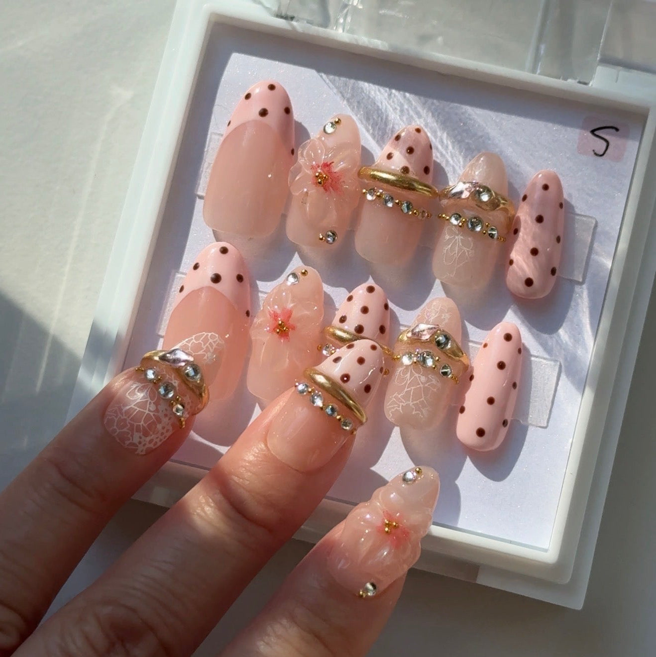 Pink Bangle handmade press on nails NZ — pink French tip with bangle accent and gemstone, mid-long almond