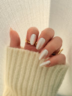 Glazed Dots handmade press on nails NZ — nude beige base with polka dots, almond shape