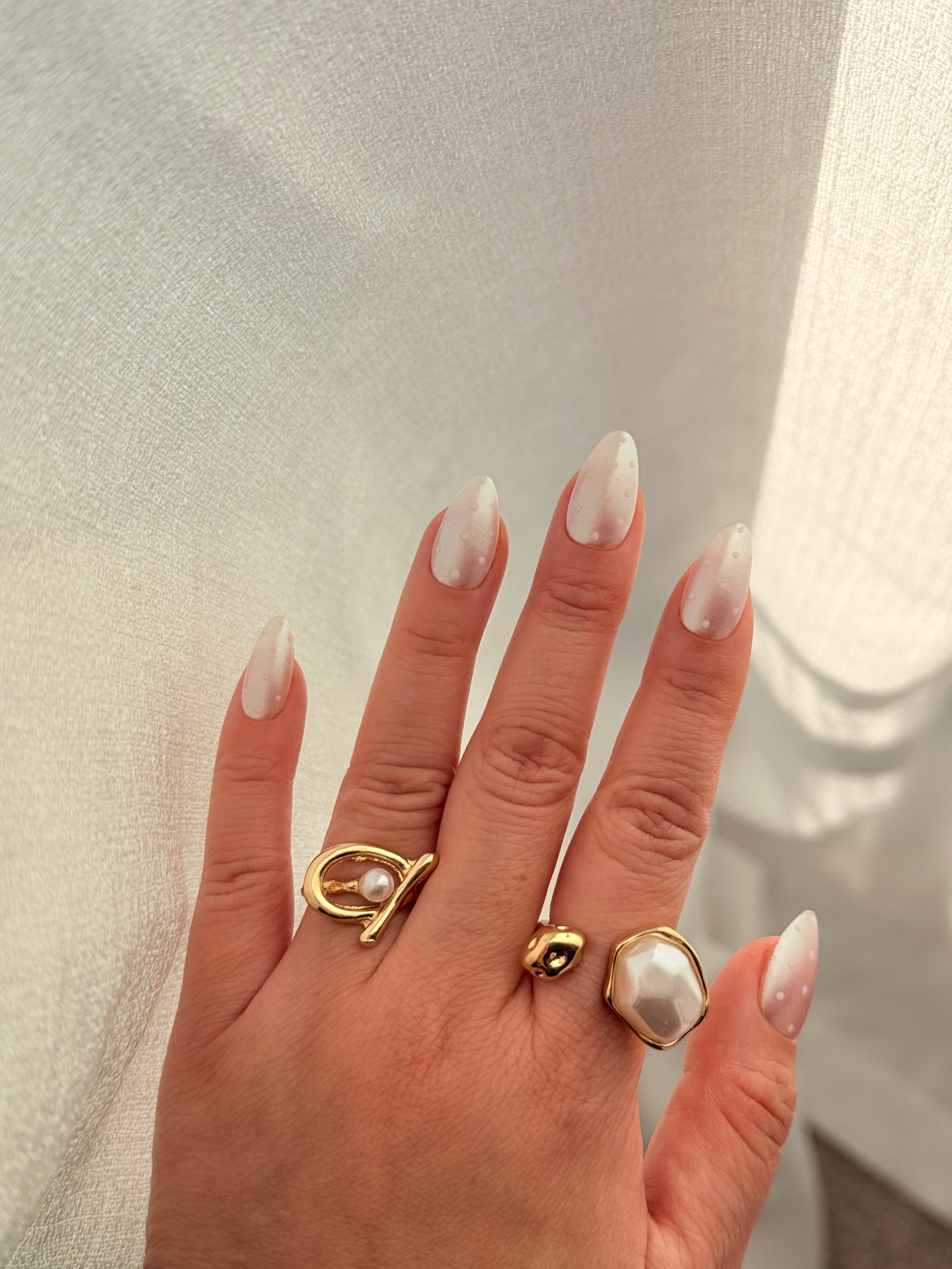 Glazed Dots nude almond press on nails worn on hand, Clarity Club NZ salon handmade