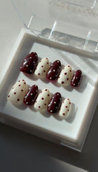 Choco Dots almond press on nails worn on hand, Clarity Club NZ